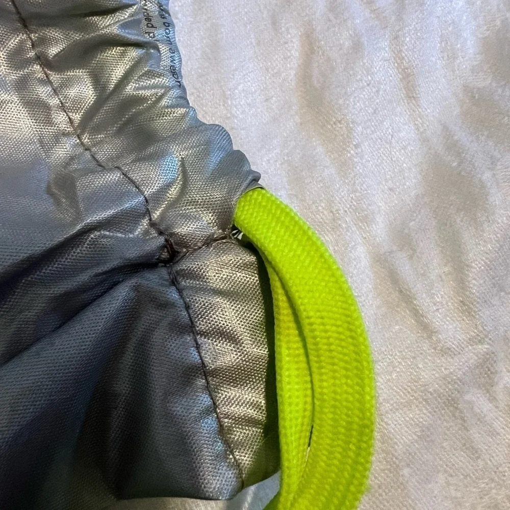Athletta girl silver and neon green  cinch sack. Used, but life left in it.